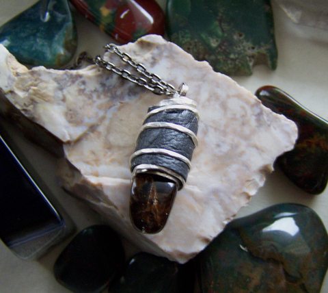 Dominican Green Amber Leather Wrapped Bullet Pendant